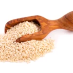 sesame seeds wooden scoop isolated white organic dry sesame seeds 157837 2113